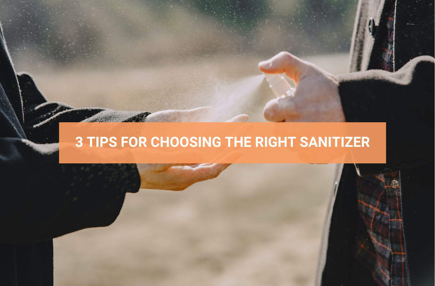 Spraying sanitizer on hands